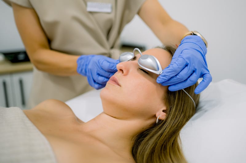 cosmetician putting protective goggles on female c 2023 11 27 04 50 44 utc (1)